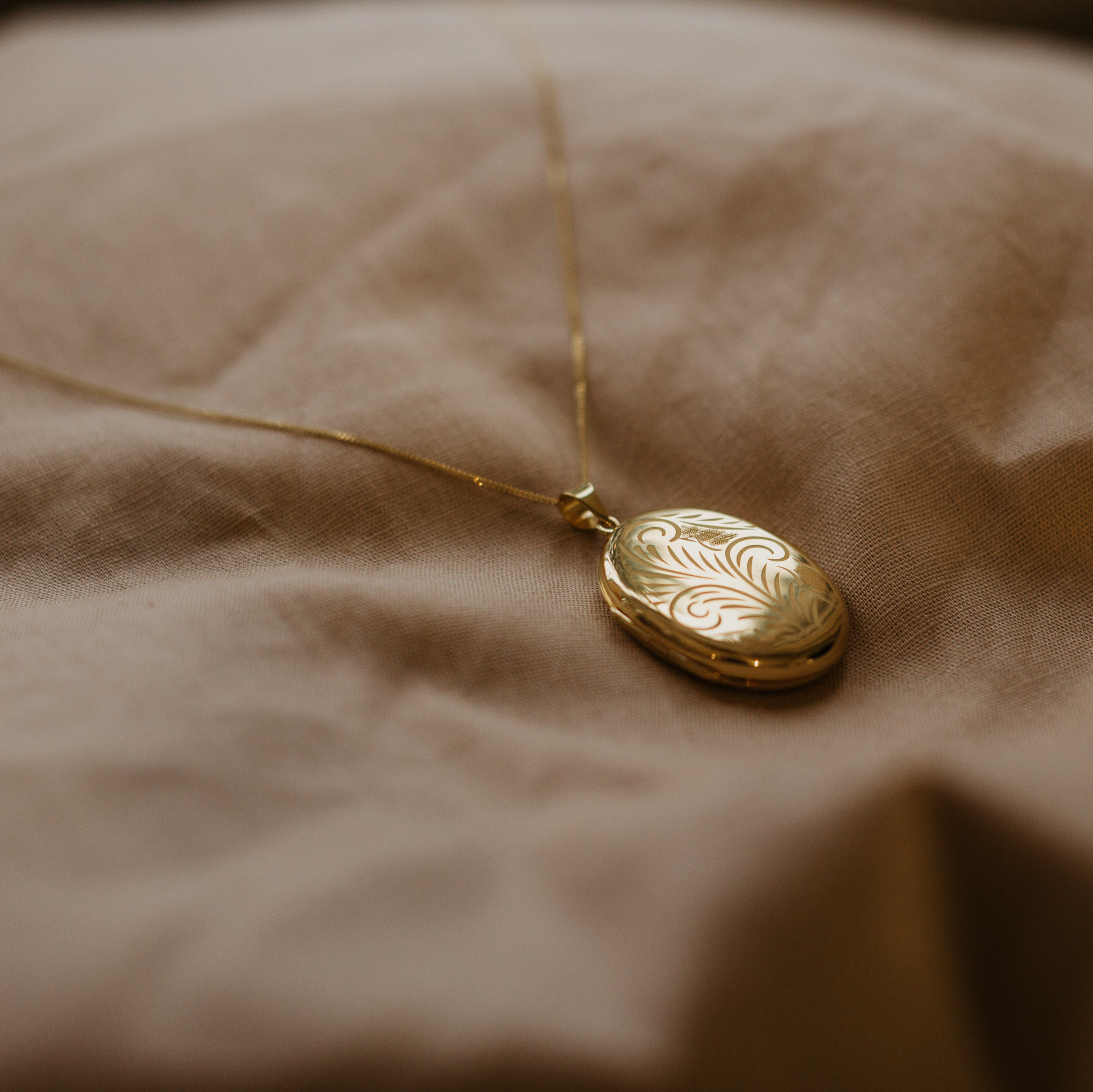 gold evelyn locket with etching as large gold design