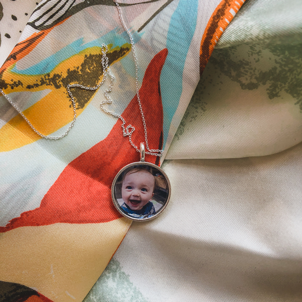 Photo of the son of a COVID nurse in a silver locket