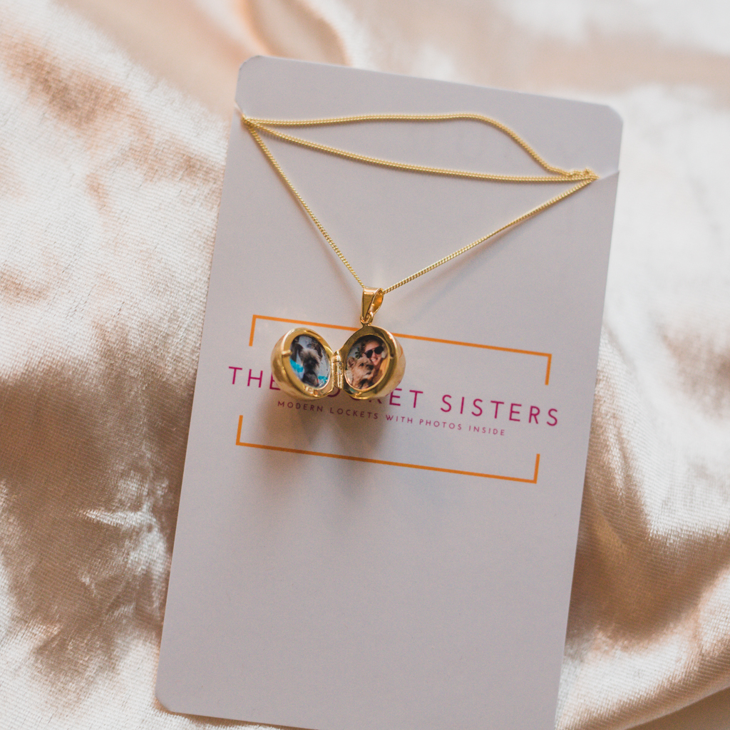 gold disco ball picture locket with double photos holding the memory of her yorkshire terrier before he passed away from lung cancer