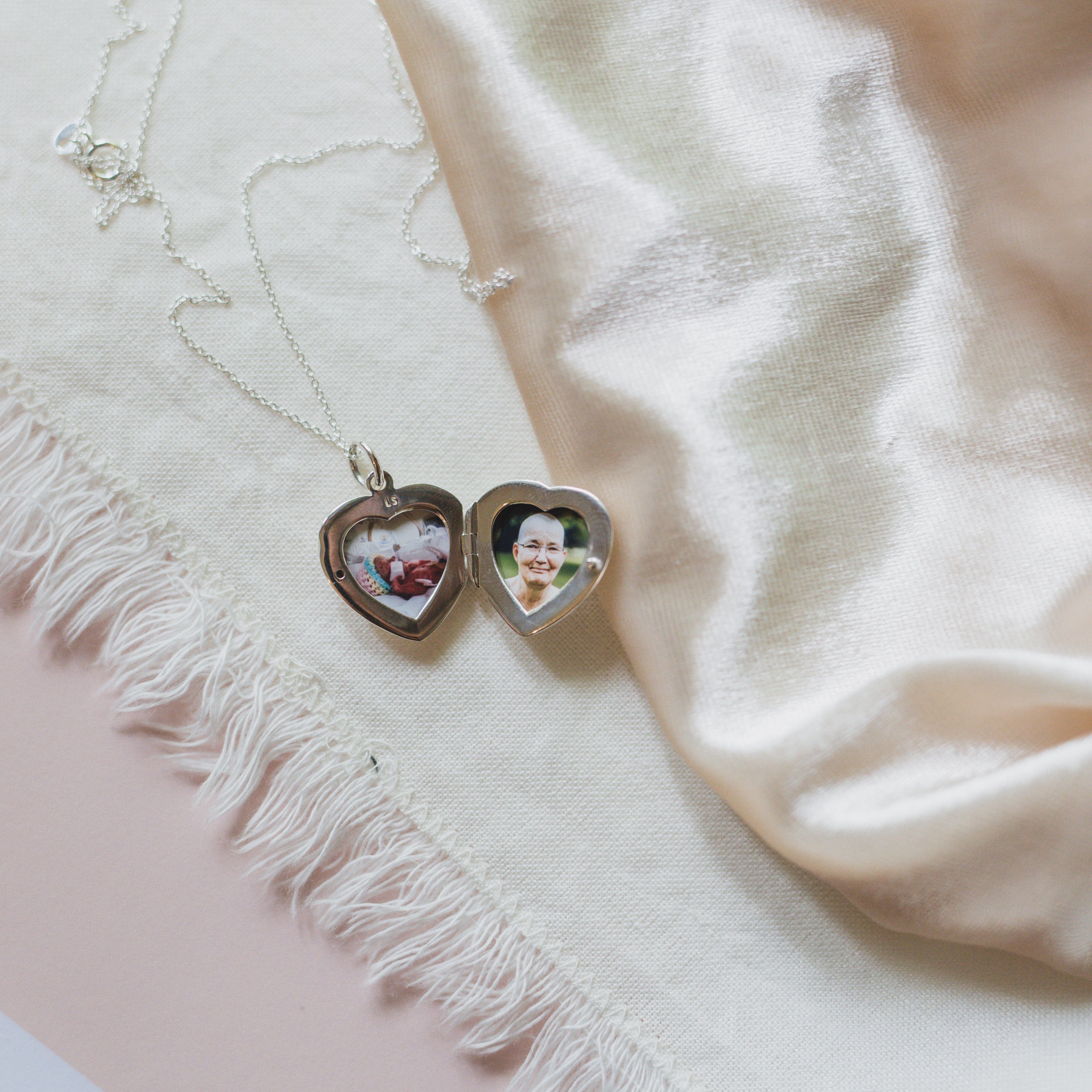 the roxie belle locket raises money for the meow meow foundation in Pasadena, CA, and this locket holds a photo of her bereaved daughter and grandmother in one silver heart locket