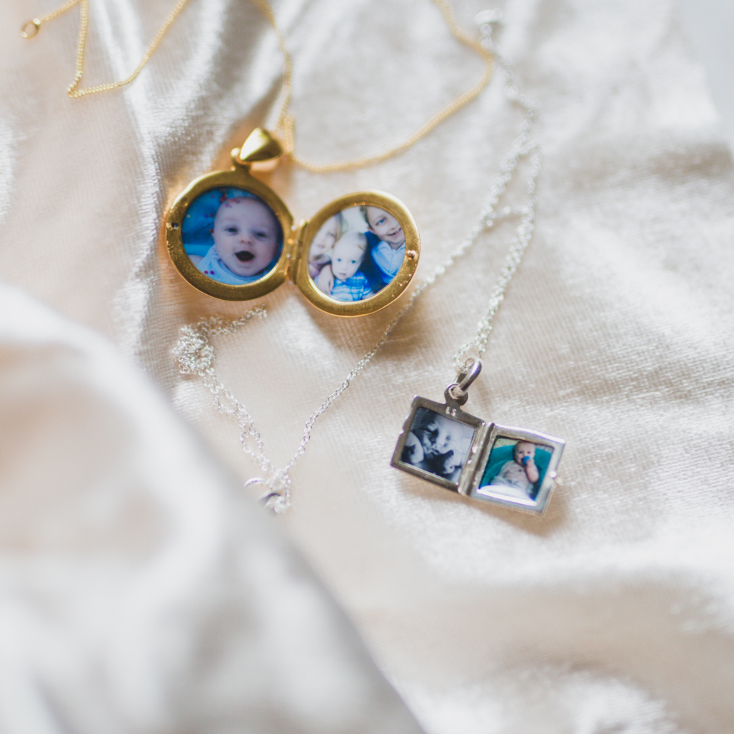 two lockets from a friend, with four photos total, one in a round one inch gold pendant, and the other a silver modern square double photo locket