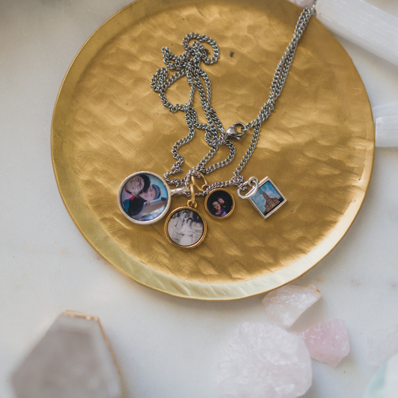 charm locket with four photos inside silver and gold pendants