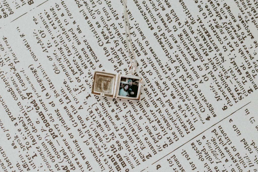 picture of couple inside silver square locket