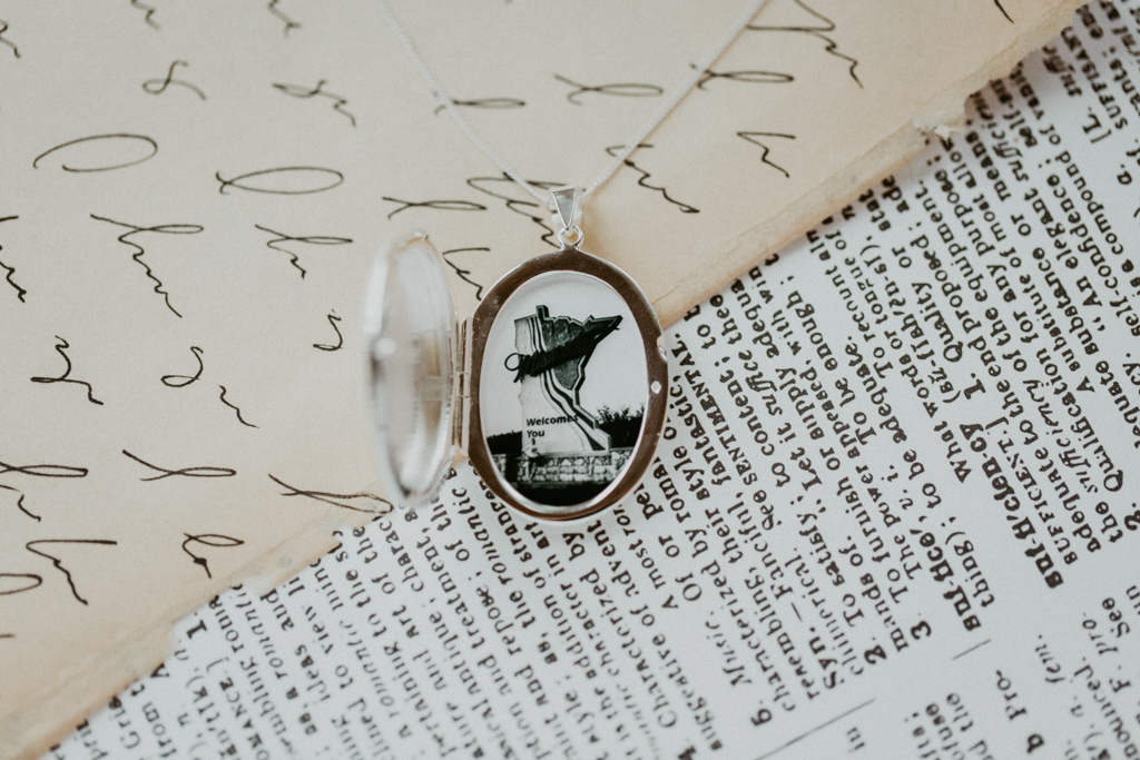 evelyn locket in silver with photograph of woman standing inside