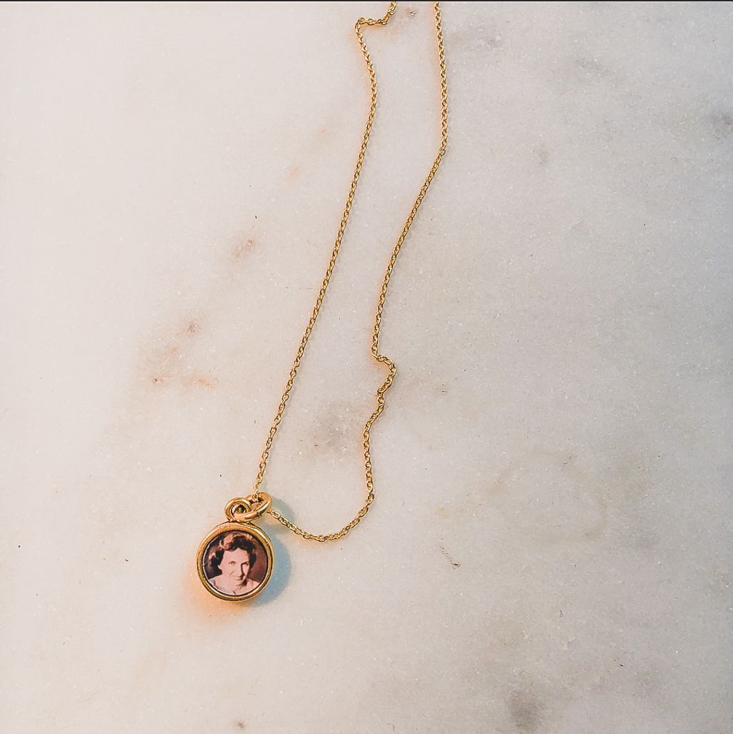 the little locket in gold with photo of grandmother inside