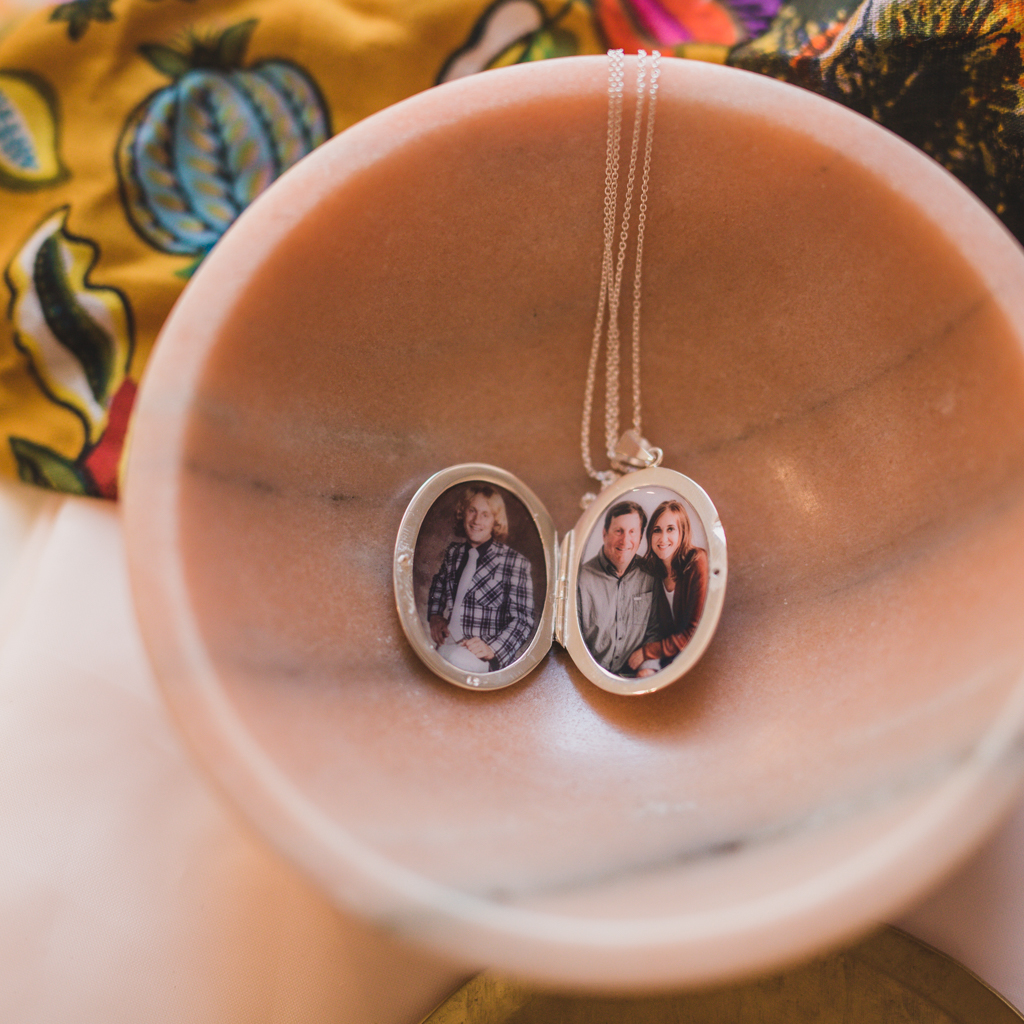 large oval etched double photo locket with photos of Dad who recently passed away from COVID