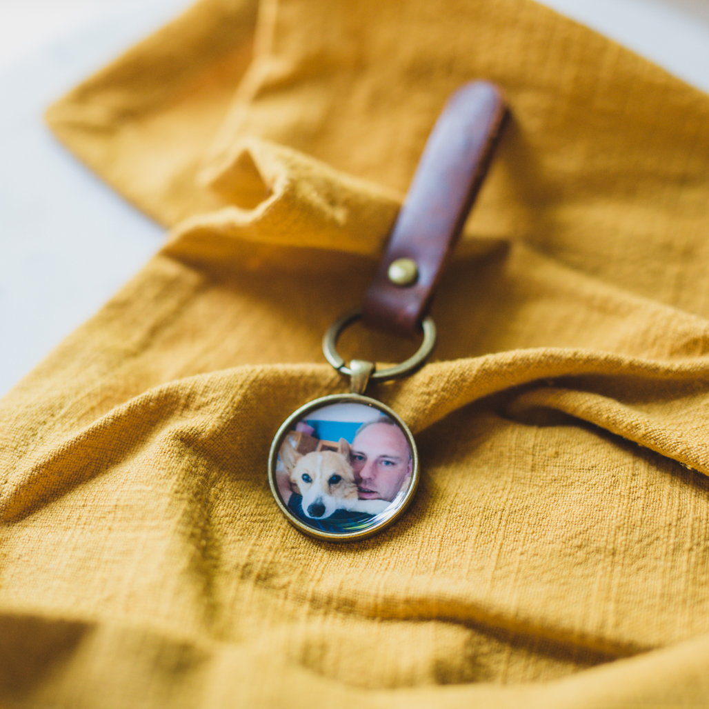 bronze pendant locket with photo inside and a leather keychain to keep their beloved dog close to his heart all the time